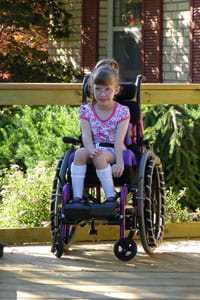 child in wheelchair on ramp