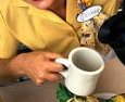 Person pouring coffee