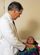 doctor examining child