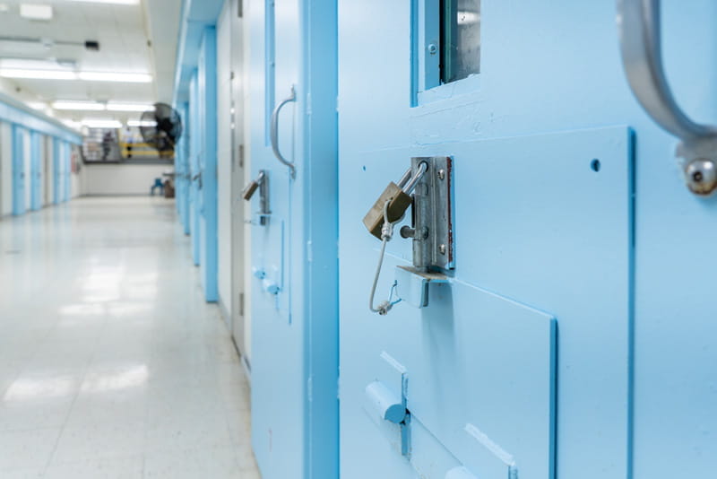A lock on a prison cell door.
