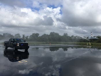 black pick up truck on wet drive track