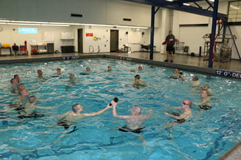 Group of people swimming in a circle