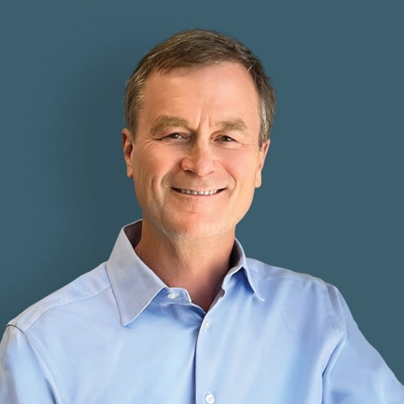 EGLE Director Phillip Roos in a blue button up, smiling at the camera