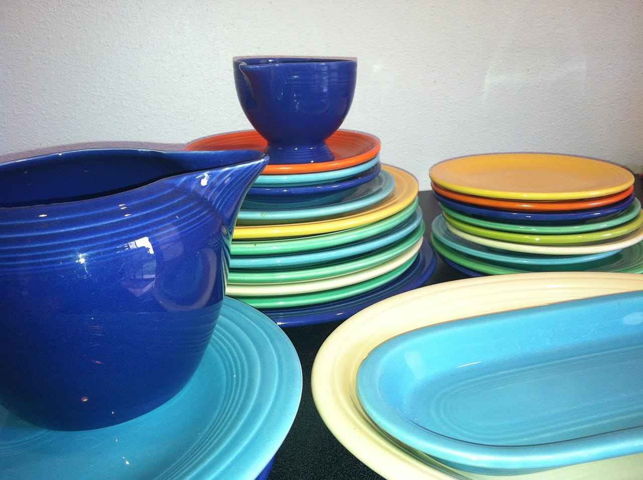 Stacks of colorful stoneware plates