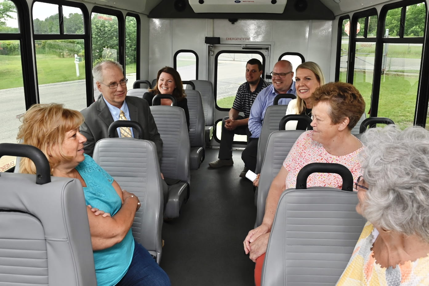 MDOT, USDOT, and transit officials ride a bus with riders and supporters. (MDOT Photo)