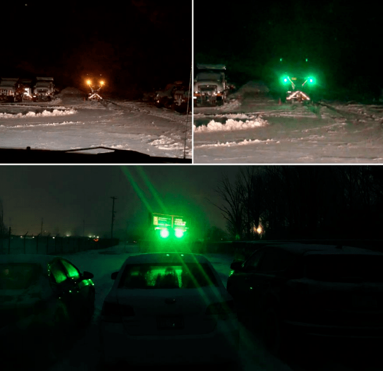 Green strobe lights on a winter maintenance vehicle.